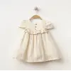 Sim Detaylı Düğmeli Kız Bebe Elbise