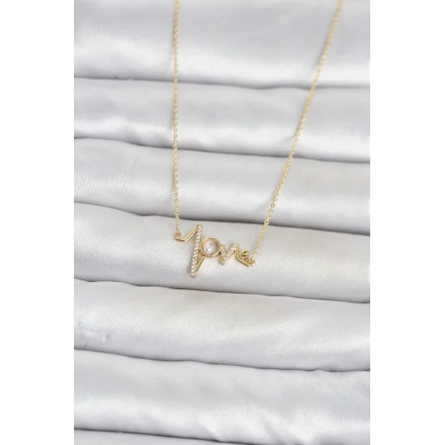 Mey İthalat® Pirinç Gold Renk Kalp Ritmi Model Kadın Kolye