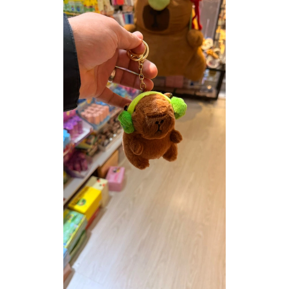 Cappypara kulaklıksı müzik dinliyor yeşil