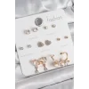 Pirinç Gold Renk Zirkon Taşlı Sallantılı Kalp Figür Kelebek Detay 7 Çift Kadın Küpe Seti
