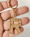 R Harfi Taşlı Gold Renk Metal Anahtarlık – Şık ve Işıltılı Harf Tasarımı