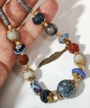 Etnik Tüy Figürlü Bohem Kolye - El Yapımı Seramik ve Rudraksha Detaylı Tasarım Takı