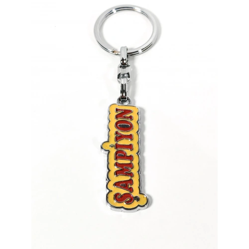 Şampiyon Yazılı Sarı Kırmızı Metal Anahtarlık – Enerjik Tasarım ve Güçlü Duruşun Eğlenceli İfadesi