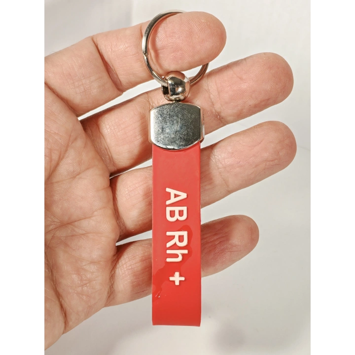 AB Rh(+) Pozitif Kan Grubu Silikon Anahtarlık – Acil Durumlar İçin Hayati Bilgi