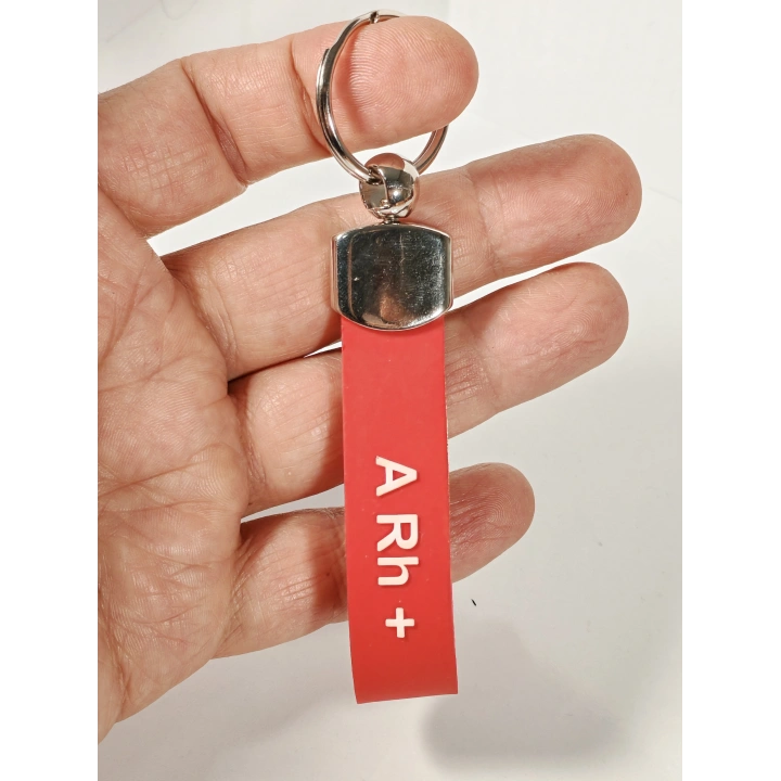 A Rh(+) Pozitif Kan Grubu Silikon Anahtarlık – Acil Durumlar İçin Hayati Bilgi