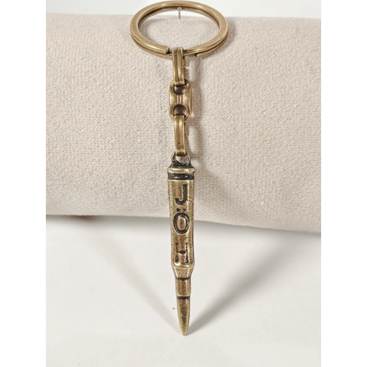 Antik Bronz Mermi Figürlü Metal Anahtarlık – Güç, Kararlılık ve Net Duruşun Sembolü