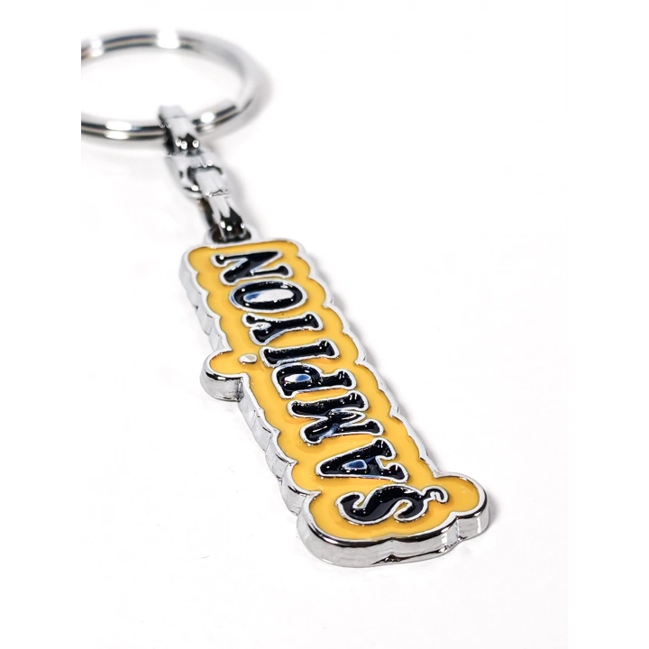 Sarı Üzerine Lacivert  “Şampiyon” Yazılı Metal Anahtarlık – Başarının ve Özgüvenin Simgesi