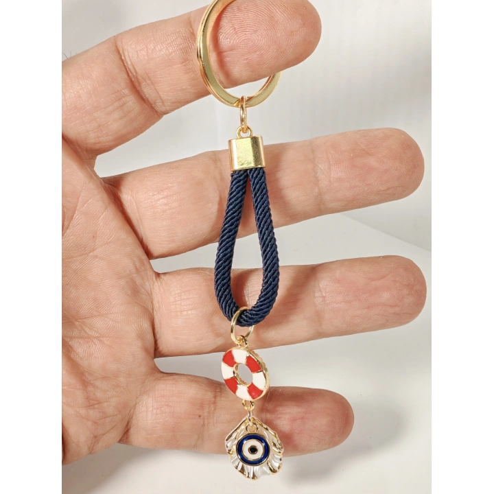 Lacivert Örgü İpli Can Simidi ve Nazar Figürlü Metal Anahtarlık – Deniz Temalı Şık ve Anlamlı Tasarım