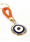 Turuncu İpli Nazar Boncuğu Detaylı Metal Anahtarlık – Şık, Anlamlı ve Dikkat Çekici Tasarım