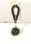 Siyah Örgü İpli Nazar Motifli Yuvarlak Metal Anahtarlık – Modern, Güçlü ve Şık Tasarım