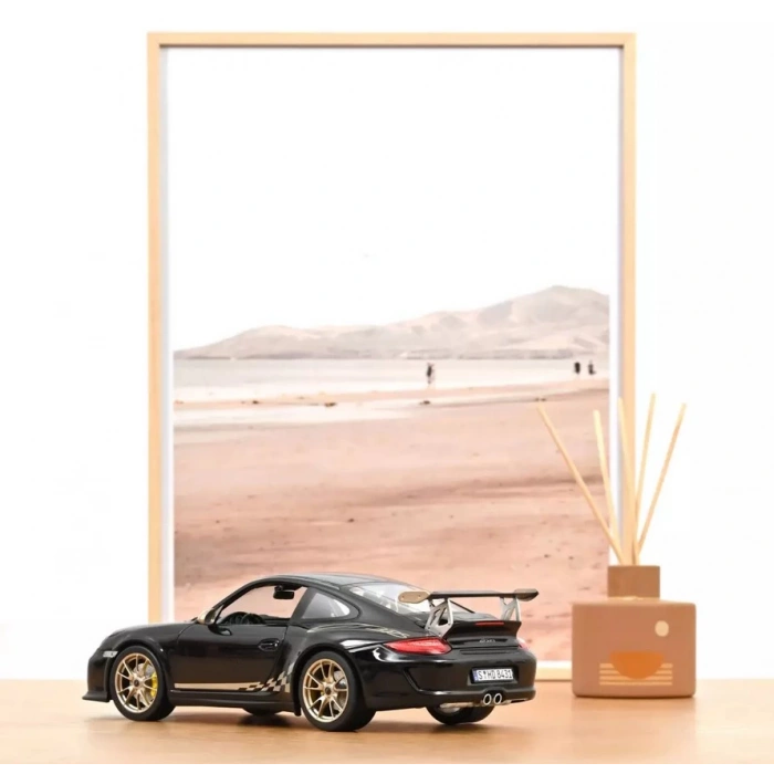 Norev 1/18 Porsche 911 GT3 RS 2009 Black & White Gold Metallic