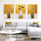 Altın Çiçeklerin Dansı: Üçlü Metal Çerçeveli Tablo Seti