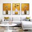 Altın Çiçeklerin Dansı: Üçlü Metal Çerçeveli Tablo Seti