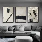 Monokromatik Şıklık: Bej ve Siyahın Kontrastı Üçlü Metal Çerçeveli Tablo Seti