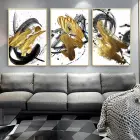 Dinamik Kontrast: Altın Fırça Darbeleri Ile Soyut Üçlü Metal Çerçeveli Tablo Seti