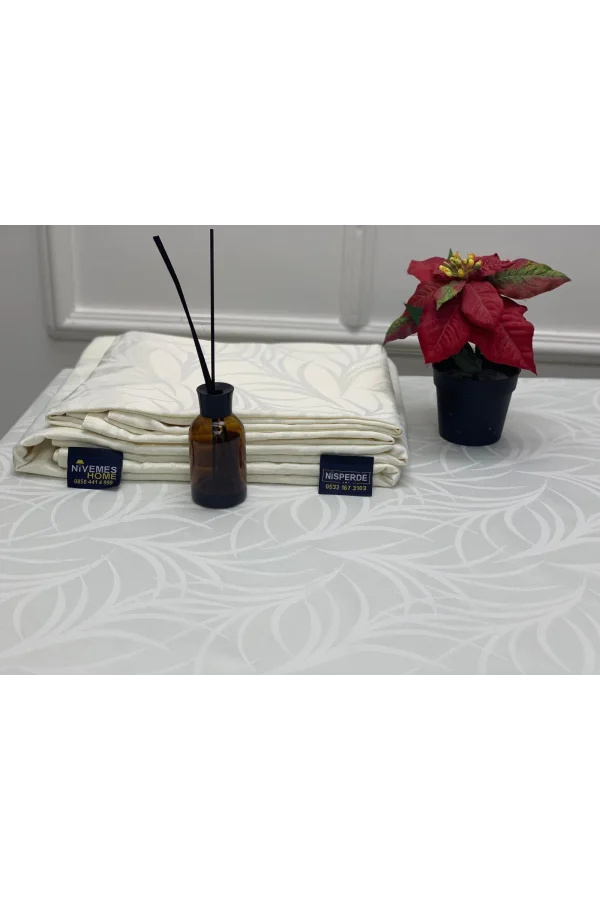 TOVAGLIA ANTIMACCHIA CON FANTASIA FOGLIE CREMA 140X200 NIVEMESHOME