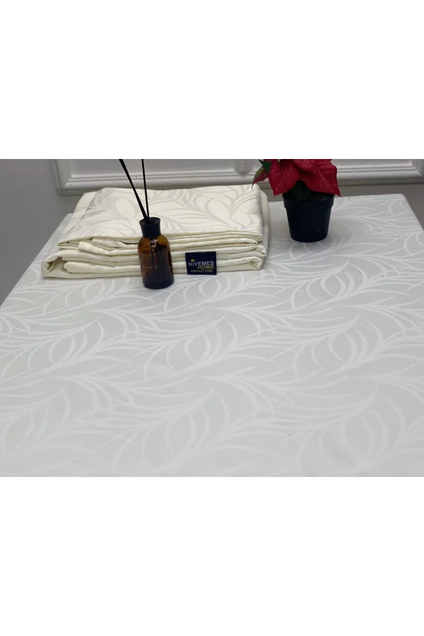 TOVAGLIA ANTIMACCHIA CON FANTASIA FOGLIE CREMA 140X200 NIVEMESHOME