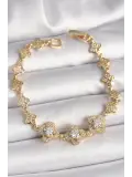 Pirinç Gold Renk Zirkon Taşlı Yonca Model Kadın Bileklik