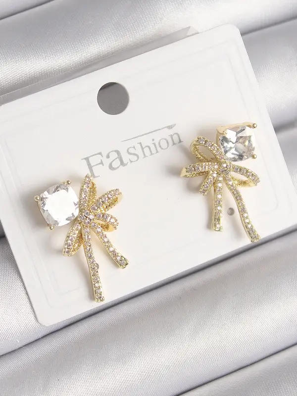 Pirinç Gold Renk Zirkon Taşlı Kurdele Model Kadın Küpe