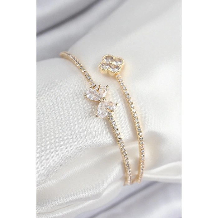 HarmonyAura Pirinç Zirkon Taşlı Fiyonk Ve Yonca Model Gold Renk Kadın Bileklik