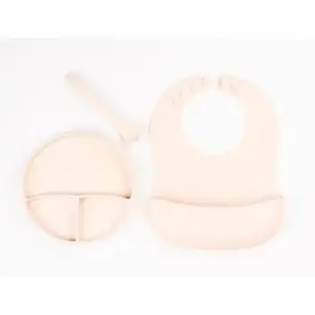 Krem Rengi 3’lü Silikon Yemek Seti – Önlük + Diş Kaşıyıcılı Kaşık + Vakumlu Tabak