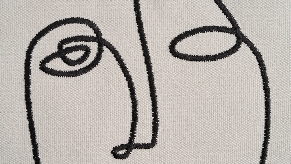 Embroidered Face Pillow