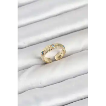Pirinç Gold Renk Mavi Zirkon Taşlı Kutup Yıldızı Model Kadın Yüzük