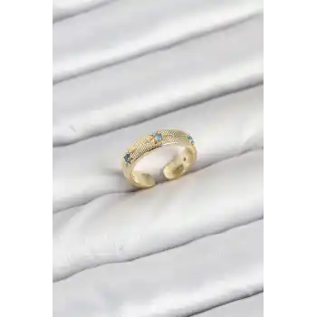 Pirinç Gold Renk Mavi Zirkon Taşlı Kutup Yıldızı Model Kadın Yüzük