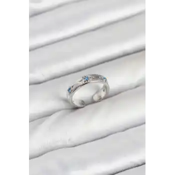 Pirinç Gümüş Renk Mavi Zirkon Taşlı Kutup Yıldızı Model Kadın Yüzük