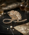 Çiçekli zirkon taşlı gold metal mandal toka