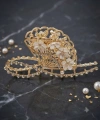 Çiçekli zirkon taşlı gold metal mandal toka