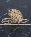 Çiçekli zirkon taşlı gold metal mandal toka
