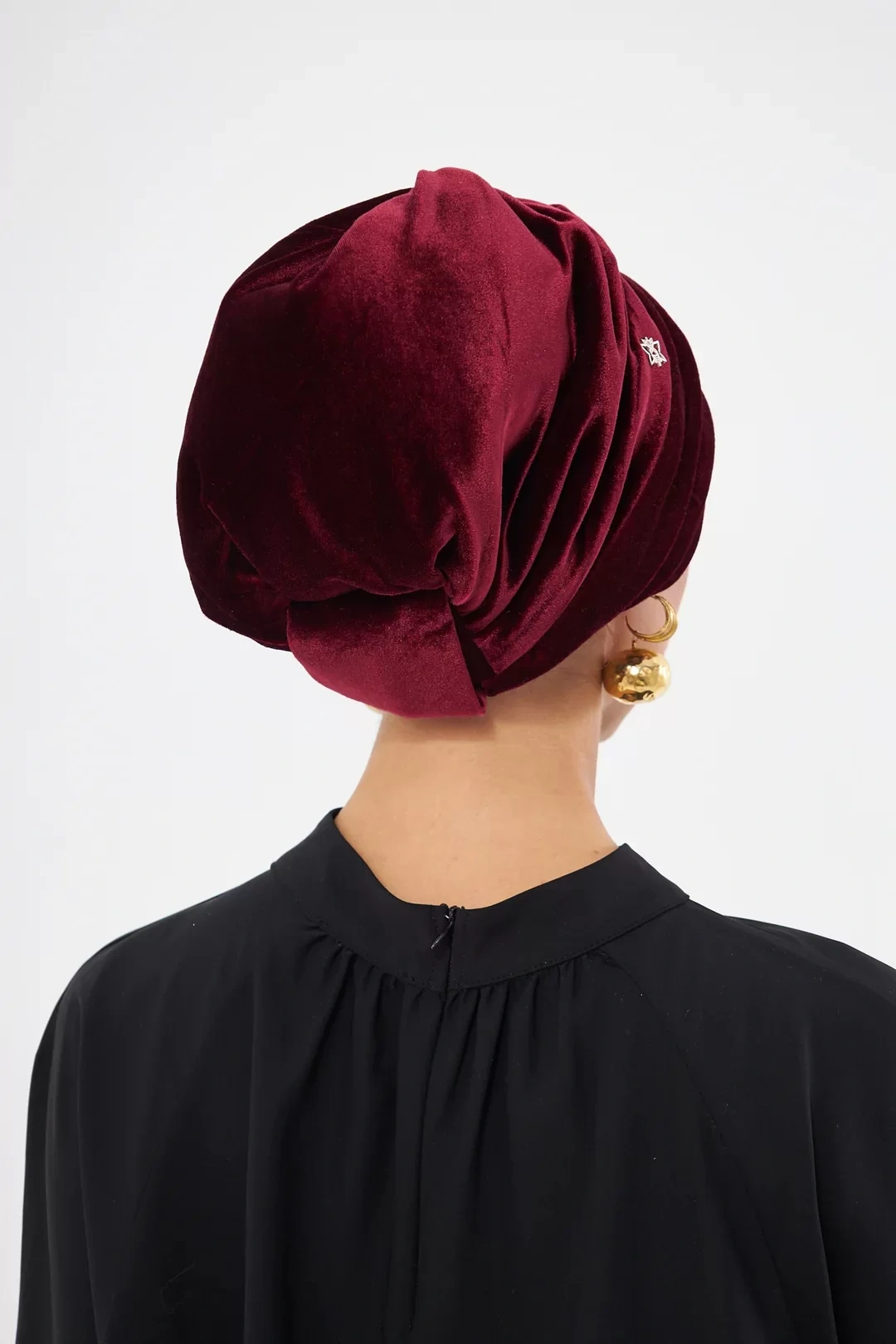 Osso riempito di velluto drappeggiato rosso bordeaux