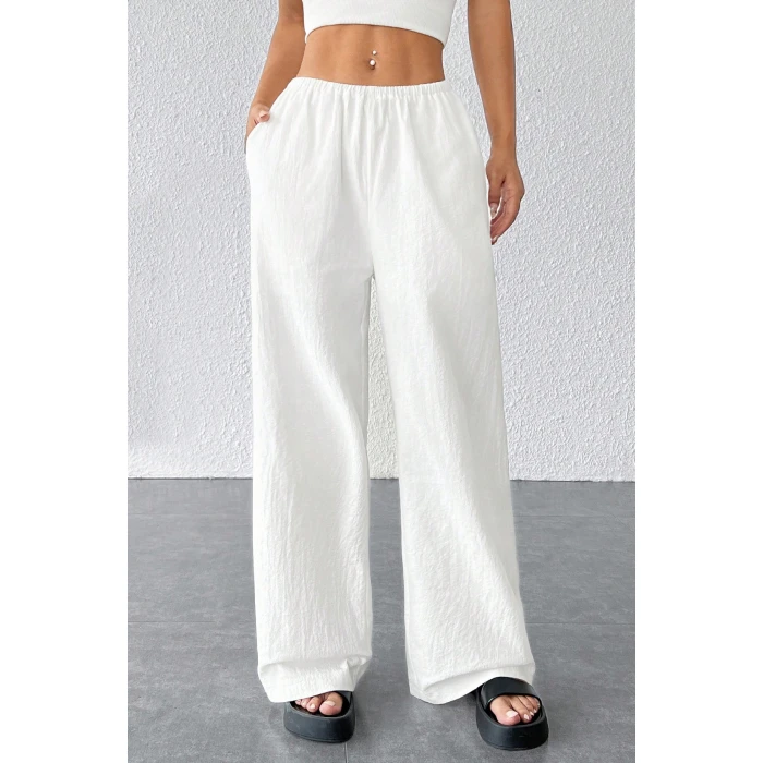 Kadın Beyaz Bol Kesim Cepli Geniş Paça Dökümlü Pantolon