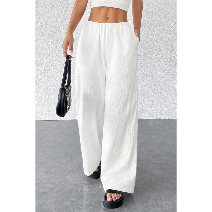 Kadın Beyaz Bol Kesim Cepli Geniş Paça Dökümlü Pantolon