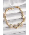 Pirinç Gold Renk Zirkon Taşlı Yonca Model Kadın Bileklik TJ-BB6812