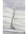 ietaks™ Pirinç Gümüş Renk Yonca Model Sıralı Zirkon Taşlı Kadın Bileklik