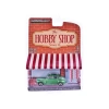 Nessiworld  Greenlight 1/64 The Hobby Shop Series 16 - 1946 Ford Fordor Super Deluxe Green Metallic with White Interior and Roof Rack with Surfboards