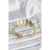 Pirinç Gold Renk Parçalı Model Kadın Bileklik