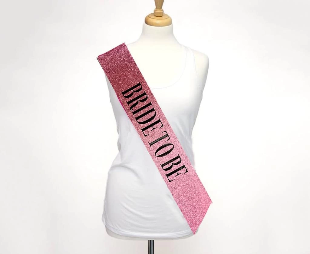 NessiWorld Pembe Üzeri Siyah Kalın Bride To Be Yazılı Simli Işıltılı Kuşak Kemer 10x80 cm
