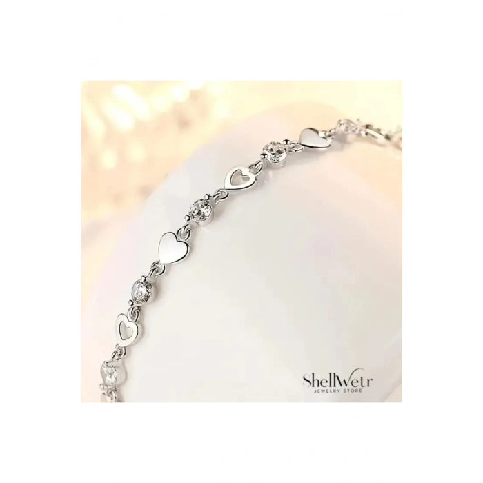 Lyra Gümüş kaplama kadın bileklik kalpli ve parlak taş detaylı bileklik