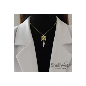 Lumine Kadın altın kaplama kolye-püsküllü fiyonk detaylı taşlı parlak kolye