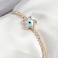 Pirinç Zirkon Taşlı Nazar Yıldız Model Gold Renk Asansörlü Kadın Bileklik - Lisinya