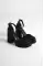 Black Satin Woman İn Front Of The Platform Heel Shoes