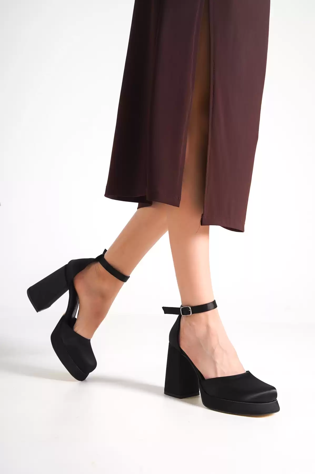 Black Satin Woman İn Front Of The Platform Heel Shoes