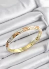 Mineli Pirinç Krem Ve Yavru Ağzı Sarmal Motifli Gold Renk Kadın Kelepçe