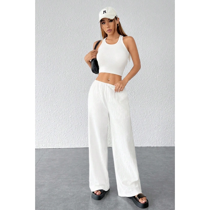 Kadın Beyaz Bol Kesim Cepli Geniş Paça Dökümlü Pantolon