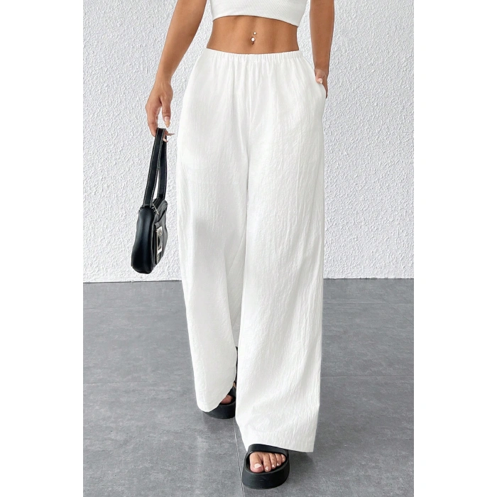 Kadın Beyaz Bol Kesim Cepli Geniş Paça Dökümlü Pantolon